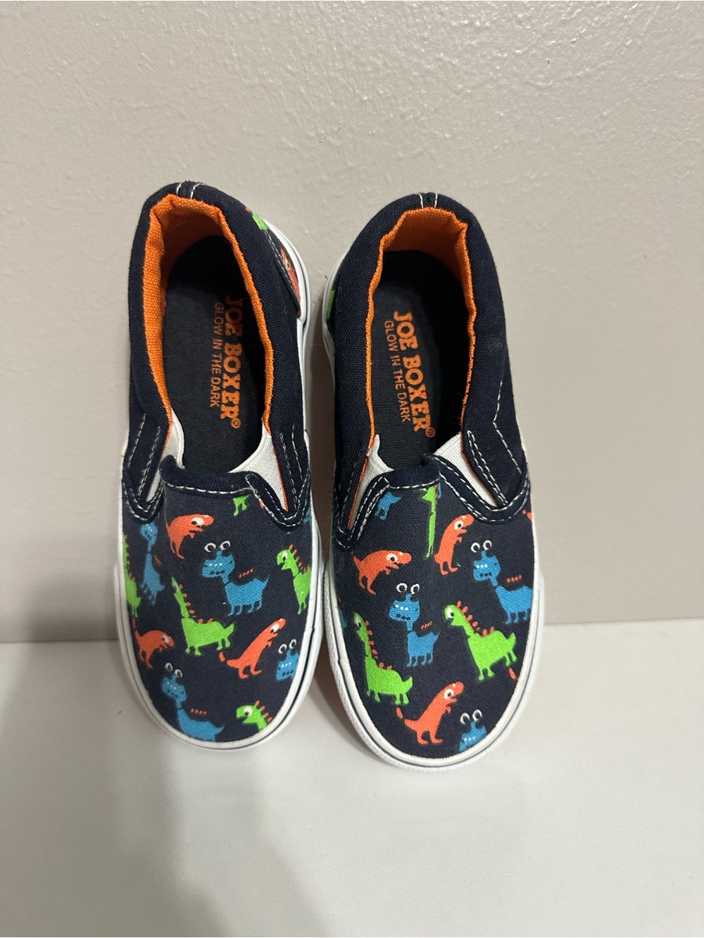 Joe Boxer Navy Slip-On Sneakers with Orange, Green & Blue Dino Print